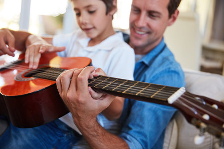 So you know this song. a father and his young son sitting together in the living room at home...