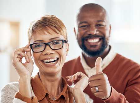 Black woman, man and thumbs up for vision, eyes healthcare or glasses shopping customer for optometry glasses. Smile portrait, mature people and like hands for fashion prescription or insurance lensの写真素材