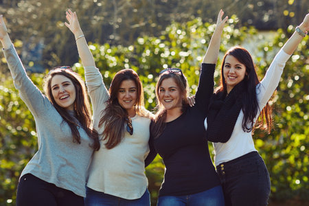 Were always up for a girls day. a group of friends enjoying themselves outdoors.の写真素材