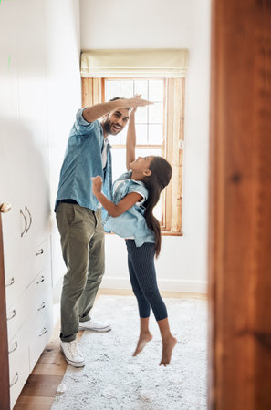 Theres always fun to be had with Dad. a happy father and daughter playing together at home.の写真素材