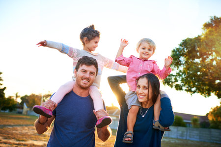Nothing but a happy family. Portrait of a happy family bonding together outdoors.