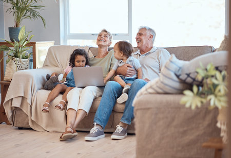 Happy, family and laptop on the sofa with children and grandparents on home sofa. Senior man and...