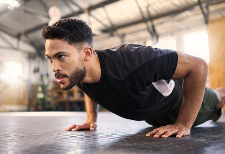 Fitness, training and push up with man in gym for training, muscle and workout endurance....