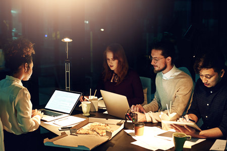 Nothing worth having comes easy, especially success. young employees working late into the evening.