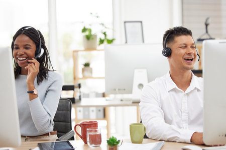 Happy, call center and team working in customer support, contact us and online help for ecommerce in office. Crm, telemarketing and smile by black woman and man consultant excited by customer serviceの写真素材