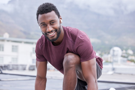 Black man, music earphones and fitness start for exercise, training or workout in Nigeria city for health, wellness or heart cardio. Portrait, smile or happy runner listening to motivation podcastの写真素材