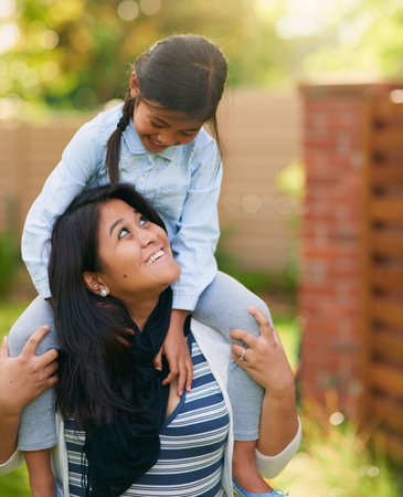 Shes the one I care about the most. a mother and daughter enjoying the day outdoors together.の写真素材
