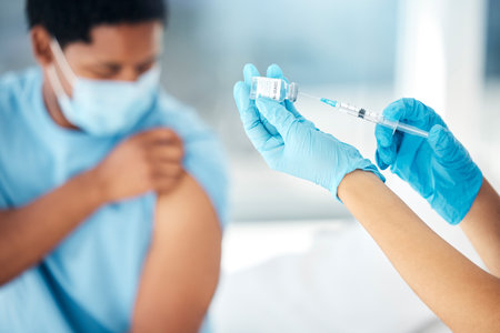 Doctor hands giving covid vaccine injection to patient for healthcare safety, medical service and bacteria risk protection in clinic. Nurse prepare syringe, vial and corona virus flu shot medicineの写真素材