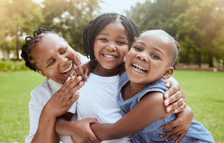 Love, black family hug and grandmother with children enjoy outdoor quality time together, peace or...