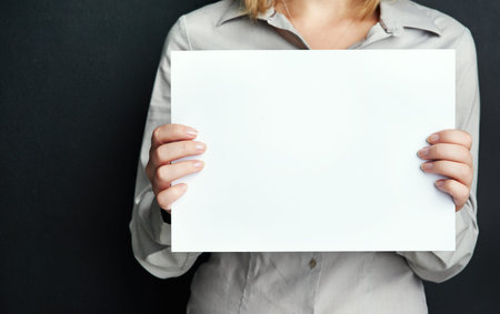 Let me make something loud and clear...Studio shot of an unrecognisable woman holding a blank board...