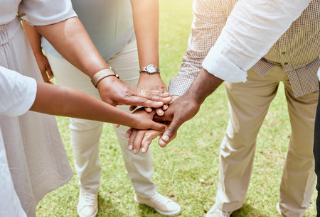 Hands, together with team and support, solidarity and trust with collaboration and community outdoor. Unity, teamwork with team building and diversity, motivation and partnership between people.の写真素材