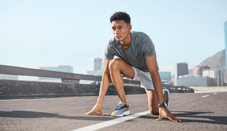 Black man, city runner and start running training on road, outdoor cardio exercise and sprinting...