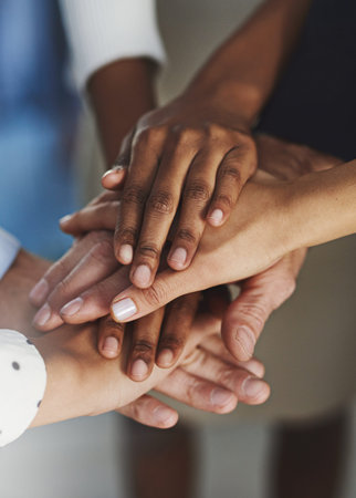 Go team. High angle shot of a group of unrecognizable coworkers hands in a huddle.