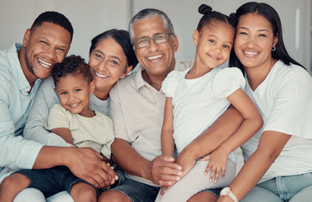 BIg family portrait, relax and together on sofa in living room at home for love, support and care. Happy, smile and quality time with grandparents, parents and excited children in family home loungeの写真素材