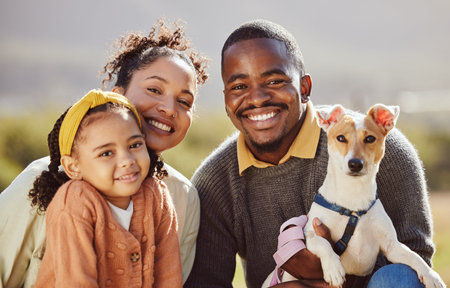 Family, children and dog with a girl, mother and father in the park with their pet canine on a...