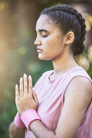 Yoga, meditation and zen with a black woman athlete training outdoor for mental health or wellness....