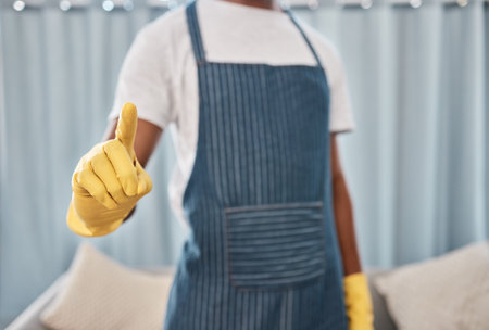 Cleaner, hand or finger in virus stop, hygiene maintenance protocol or bacteria compliance rules of hotel, office building or home. Zoom, black man or cleaning service worker or safety control glovesの写真素材