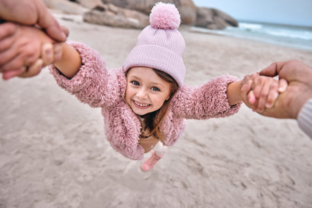Girl, father or playing in spinning game on beach, ocean or sea holiday pov in trust, security or love. Portrait, smile or happy child bond with dad, man or parent in fun or exciting nature activityの写真素材