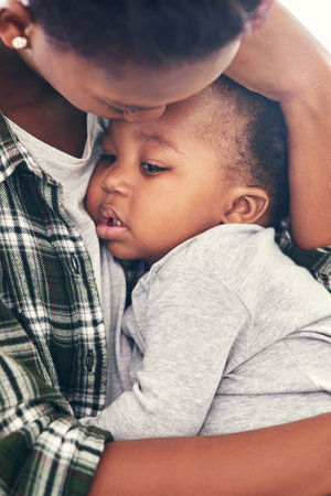 Hush my little baby. a mother cradling her little baby boy.の写真素材