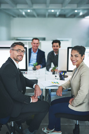 Success is the product of teamwork. corporate colleagues working together in their office.