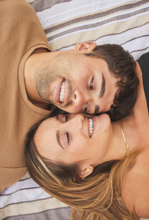 Couple, love and face happy together on relax quality time or marriage romance vacation. Young...