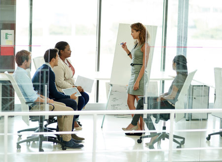 A group of colleagues brainstorming in an office.