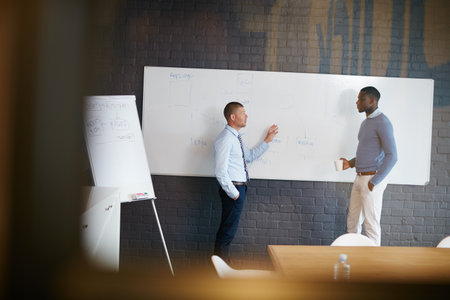 Two businessmen having a discussion in the boardroom.の写真素材