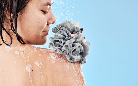 Shower, sponge and woman cleaning body with water, soap foam and skincare for wellness, personal...