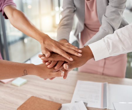 Hands, team and business people support and solidarity, diversity in the workplace with collaboration and team building. Teamwork, business meeting and agreement with staff on project and deal.の写真素材