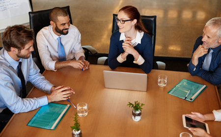 The team that makes things happen. a group of businesspeople having a boardroom meeting.