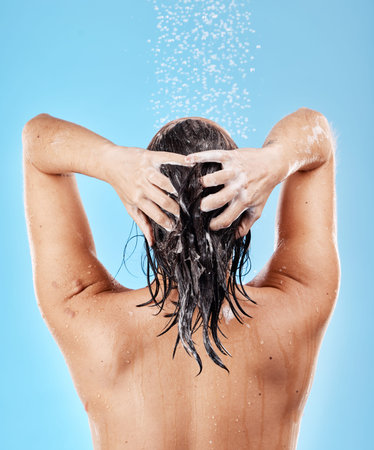 Beauty, skincare and haircare, woman in shower from back on blue background, shampoo and hygiene...