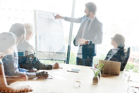 Strategic planning gives them the competitive advantage. Multiple exposure shot of colleagues in a...
