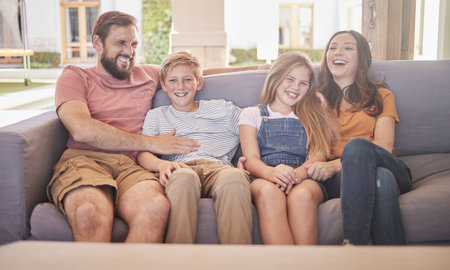 Happy, family and relax on a sofa with kids and parents laughing in a living room together, cheerful...