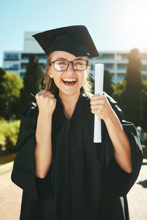 Graduation, education and success with a woman student or graduate in celebration of an academic...