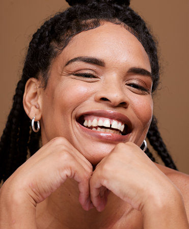 Beauty, black woman and smile with dental treatment for beauty model on a brown studio background. Oral health, dental health and teeth with a big smile and african american female for wellnessの写真素材