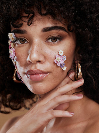 Woman, beauty and face in fine art makeup, cosmetics or facial flower decor for profile or skincare design. Portrait of creative female model posing with beautiful floral cosmetic art deco treatmentの写真素材