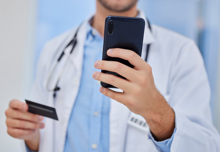 Phone, hands or doctor with credit card payment in hospital for online shopping, ecommerce or digital banking app. Healthcare expert, buy or pay with smartphone for website store purchase in clinicの写真素材