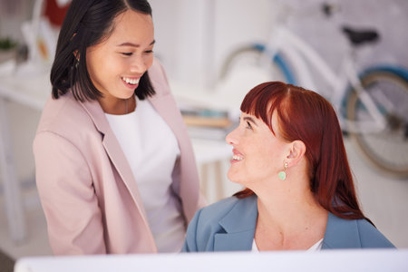 Planning, thinking and happy business women discussing goal, vision and startup dream while bonding in office. Happy, work and friends sharing mission, strategy and idea while enjoying conversationの写真素材