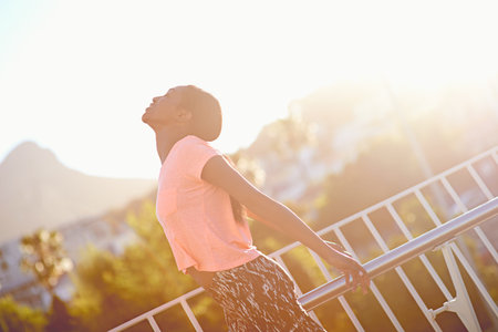 Enjoying her freedom. an attractive young woman exercising outdoors.