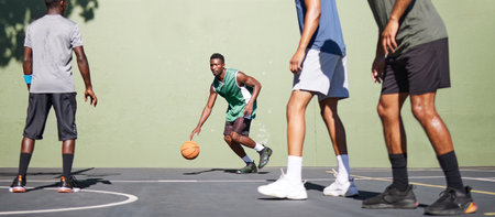 Sports, training and teamwork with man on basketball court for fitness, workout and exercise. Cardio, summer and friends with basketball player for energy, stamina and endurance in competition gamesの写真素材