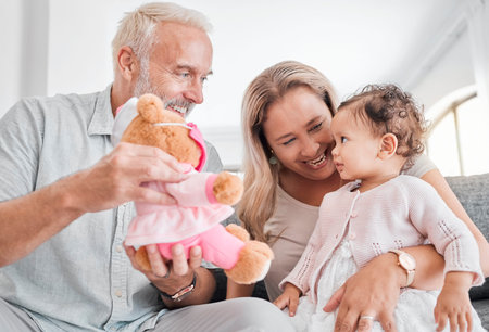 Toy, grandparents and baby play, happy and smile together in family home. Family, teddy bear and...