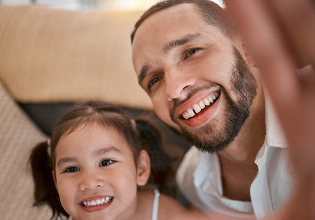 Happy, care and selfie of father with child to bond, relax and smile together in Mexico family home. Family, trust and happiness of dad with young daughter photograph for memory of togetherness.の写真素材