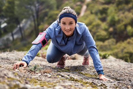 Mountains, climbing and woman, portrait and exercise, hiking and motivation in nature. Happy young...