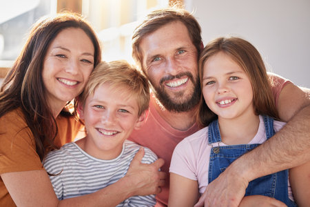 Happy family, kids and parents, portrait and love, living room and relax, bonding and care, quality time and together in Australia house. Mother, father and children in family home, hug and happinessの写真素材