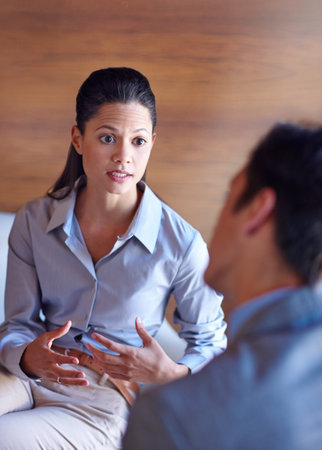 I take this seriously. two professional coworkers having a discussion at the office.の写真素材