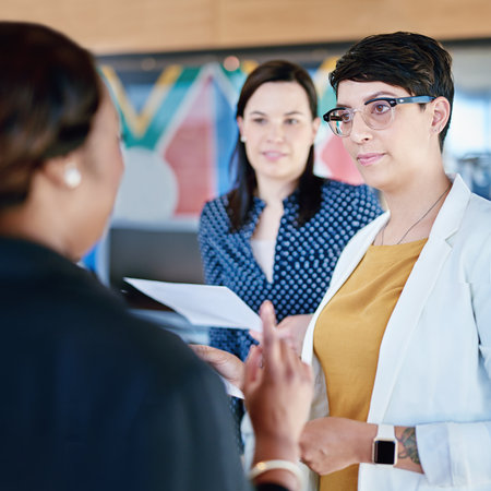 Coming to her with an idea. corporate businesspeople meeting in the boardroom.の写真素材