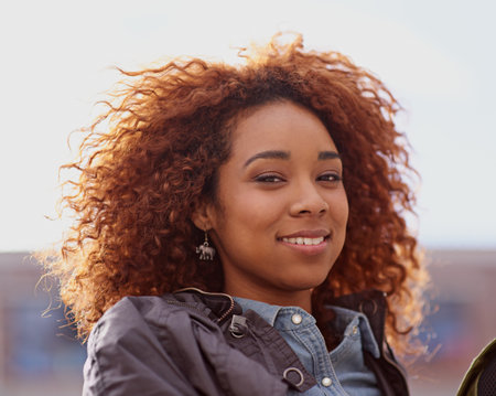 Campus confidence. a female smiling at the camera.の写真素材