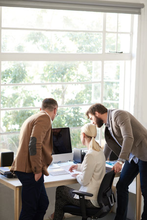 Teamwork and creativity. a group of creative professionals working in an office.