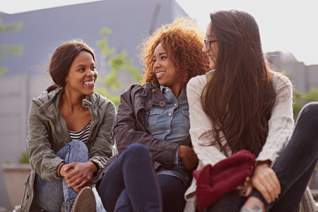 Friends uplift the soul. girlfriends bonding on campus.の写真素材