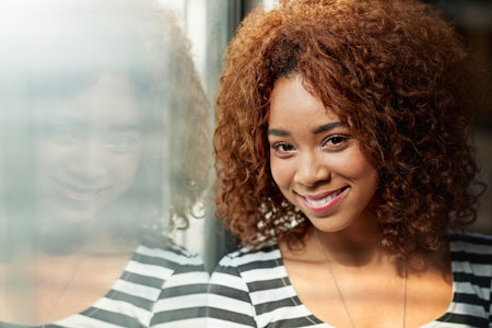 The smile of guaranteed success. Cropped portrait of an attractive young businesswoman standing in...